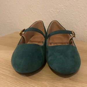Suede green Mary Jane’s with gold embellishments.
